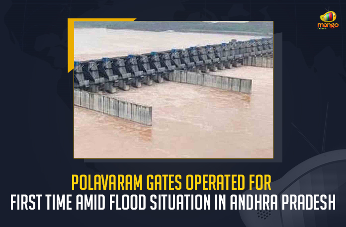 Polavaram Gates Operated For First Time Amid Flood Situation In Andhra Pradesh, Flood Situation In Andhra Pradesh, Polavaram Gates Operated For First Time, Polavaram Gates Operated, Polavaram flood water release spillway system, hydraulic gates were lifted to control the flash flood lifted and simultaneously released 15 lakh cusecs of water, 15 lakh cusecs of water, Polavaram project is still under construction, lifting of all 48 gates proved their efficiency and the role of gates became crucial in releasing flood water, Polavaram project will have radial gates along with river sluice gates at the dead storage level, Polavaram Gates Opened, Polavaram Gates Operated News, Polavaram Gates Operated Latest News, Polavaram Gates Operated Latest Updates, Polavaram Gates Operated Live Updates, Mango News,